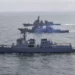 In this photo provided by South Korea Defense Ministry, South Korean Navy's destroyer Yulgok Yi I, bottom, U.S. Navy's the guided missile destroyer USS Benfold and Japan Maritime Self-Defense Force's destroyer Atago, top, sail during a joint missile defense drill among South Korea, the United States and Japan in the international waters of the east coast of Korean peninsular, Monday, April 17, 2023.