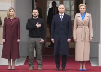 Poland's President Andrzej Duda, 2nd right, with his wife Agata Kornhauser-Duda welcomes Ukrainian President Volodymyr Zelenskyy with his wife Olena, left, as they meet at the Presidential Palace in Warsaw, Poland, Wednesday, April 5, 2023.