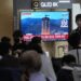 A TV screen shows a file image of North Korea's rocket launch during a news program at the Seoul Railway Station in Seoul, South Korea, Wednesday, May 31, 2023.