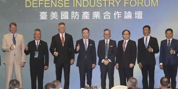 Senior Director of the Asia Pacific Teledyne FLIR Defense Robert Moss, from left, Chairman of the Aerospace Industrial Development Corporation Kai-Hung Hu, retired U.S. Marine Corps Lt. Gen. Steven Rudder, Chairman of the Taiwan External Trade Development Council James Huang and President of U.S.-Taiwan Business Council Rupert Hammond-Chambers pose during the Taiwan-U.S. Defense Industry Forum at the Taipei International Convention Center in Taipei, Taiwan, Wednesday, May 3, 2023.