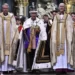 Britain's King Charles III wearing the Imperial state Crown and carrying the Sovereign's Orb and Sceptre leaves Westminster Abbey after coronation in central London Saturday, May 6, 2023.