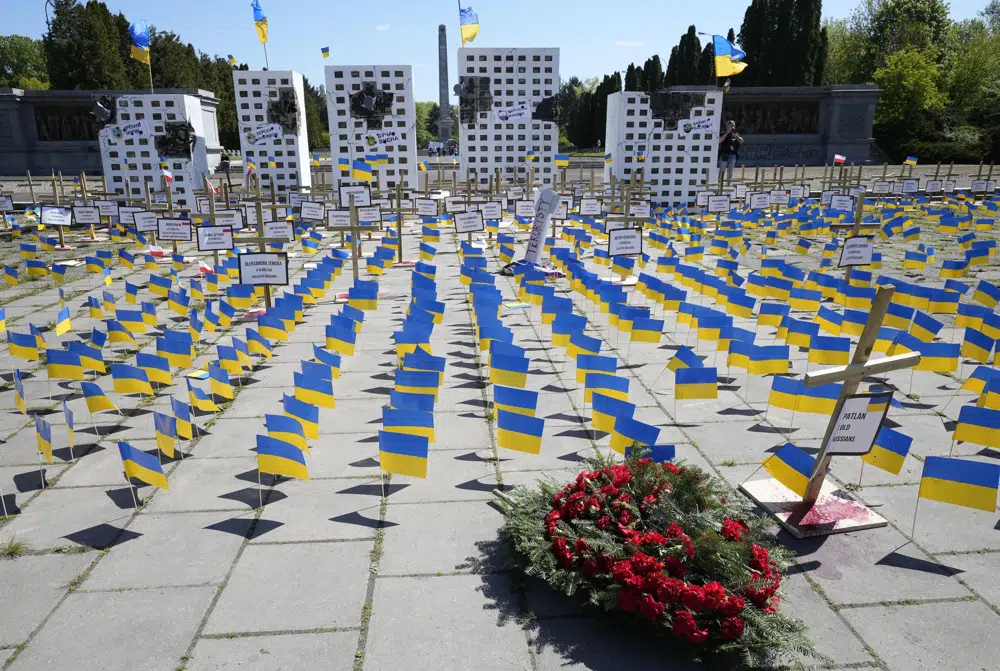 Poland: Ukrainian Flags Block Russian Envoy’s Path To Soviet Soldiers ...