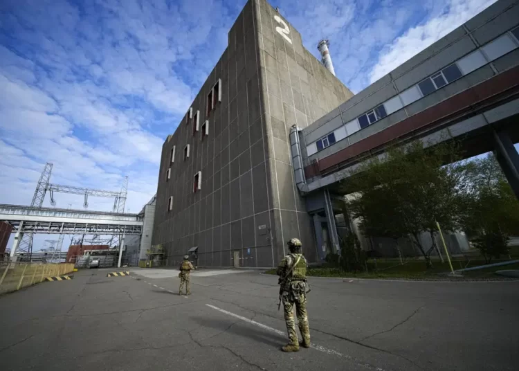 Russian servicemen guard an area of the Zaporizhzhia Nuclear Power Station, the largest nuclear power plant in Europe and among the 10 largest in the world in Enerhodar, Zaporizhzhia region, in territory under Russian military control, southeastern Ukraine, on May 1, 2022.