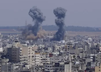 Smoke rises over the skyline following an Israeli airstrike, in Gaza