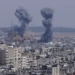 Smoke rises over the skyline following an Israeli airstrike, in Gaza