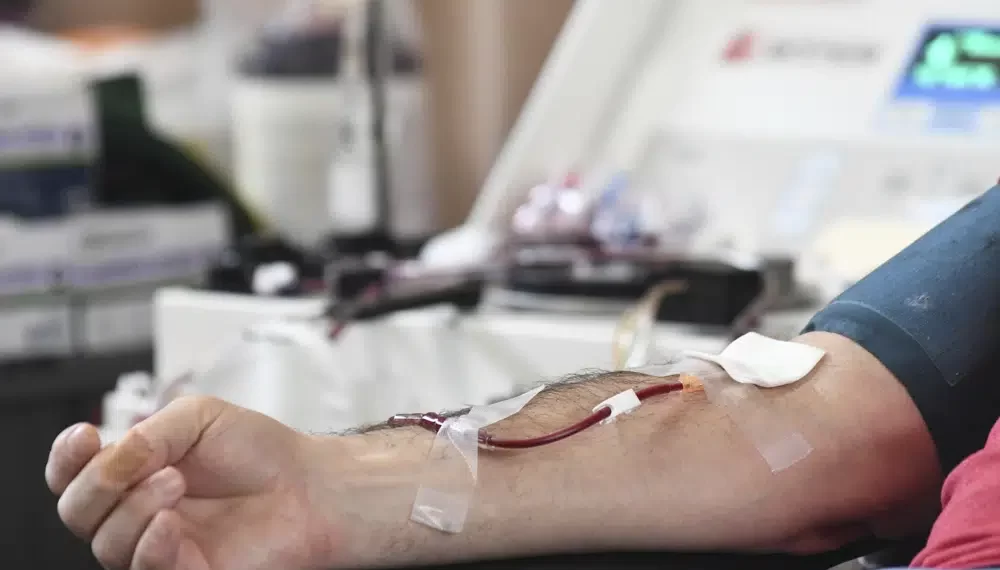 A person donates blood.
