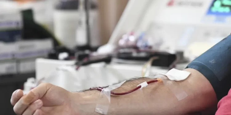 A person donates blood.