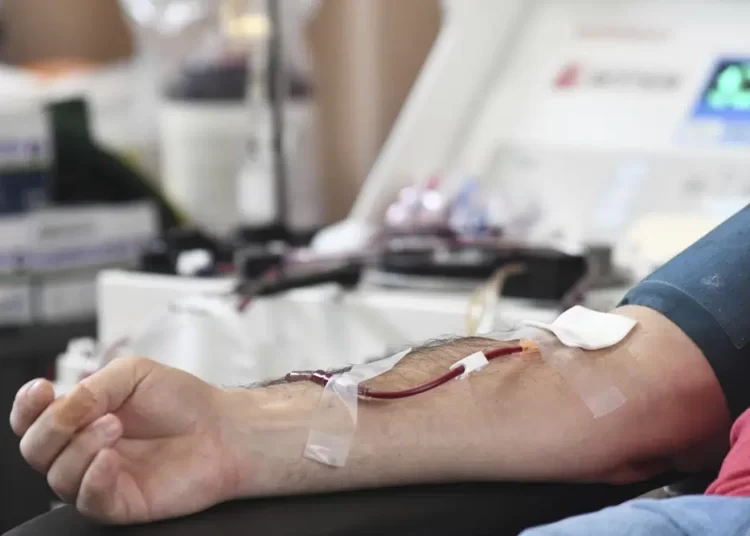 A person donates blood.