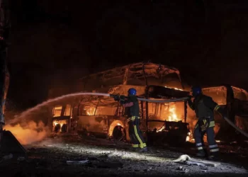 In this photo provided by the Ukrainian Emergency Situations Ministry, firefighters put out fire caused by fragments of a Russian rocket after it was shot down by air defense system during the night Russian rocket attack in Kyiv, Ukraine, early hours Tuesday, May 16, 2023.