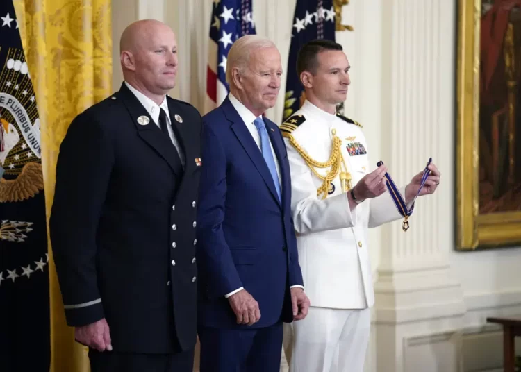 Biden Awards 9 With Medal of Valor 1 U.S President Joe Biden listens before presenting the Medal of Valor, the nation's highest honor for bravery by a public safety officer, to Lt. Justin Hespeler, of the New York City Fire Dept., during an event in the East Room of the White House, Wednesday, May 17, 2023, in Washington.