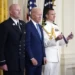 U.S President Joe Biden listens before presenting the Medal of Valor, the nation's highest honor for bravery by a public safety officer, to Lt. Justin Hespeler, of the New York City Fire Dept., during an event in the East Room of the White House, Wednesday, May 17, 2023, in Washington.