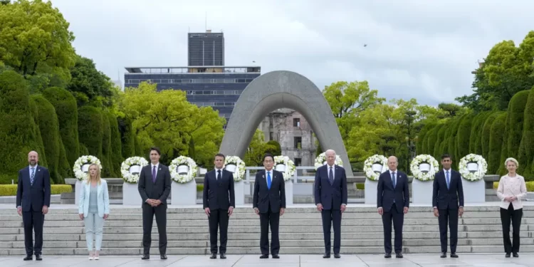 President Joe Biden, fourth right, and other G7 leaders pose for a photo during a visit to the Hiroshima Peace Memorial Park in Hiroshima, Japan, Friday, May 19, 2023, during the G7 Summit. Pictured from left: President Charles Michel of the European Council, Prime Minister Giorgia Meloni of Italy, Prime Minister Justin Trudeau of Canada, President Emmanuel Macron of France, Prime Minister Fumio Kishida of Japan, U.S. President Joe Biden, Chancellor Olaf Scholz of Germany, Prime Minister Rishi Sunak of the United Kingdom and President Ursula von der Leyen of the European Commission.