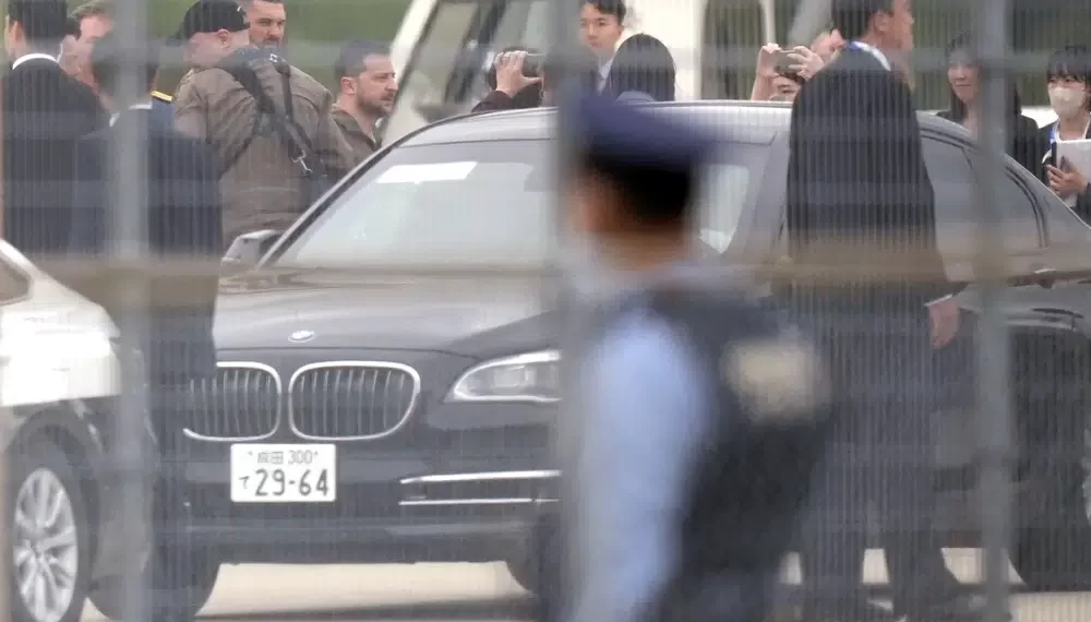 Ukrainian President Volodymyr Zelenskyy walks to a car upon his arrival at Hiroshima Airport to attend the Group of Seven (G-7) nations' meetings Saturday, May 20, 2023, in Hiroshima, western Japan.