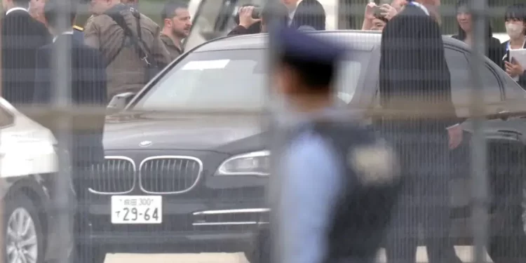 Ukrainian President Volodymyr Zelenskyy walks to a car upon his arrival at Hiroshima Airport to attend the Group of Seven (G-7) nations' meetings Saturday, May 20, 2023, in Hiroshima, western Japan.