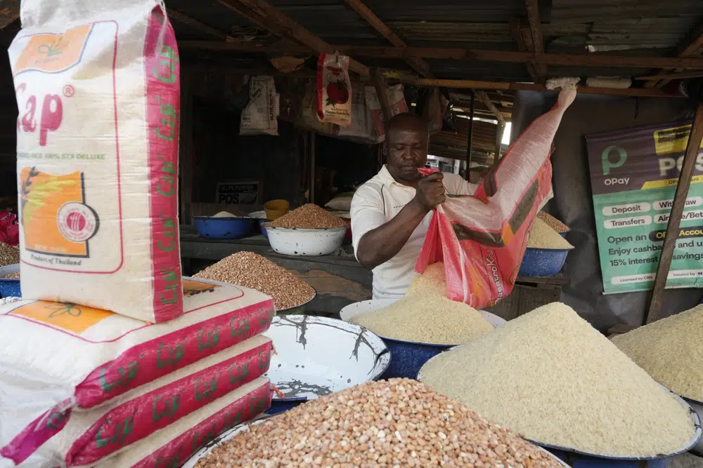 Nigerians Set For Their New President, Will Tinubu Deliver 4 A man sells food at a market in Lagos Nigeria 1