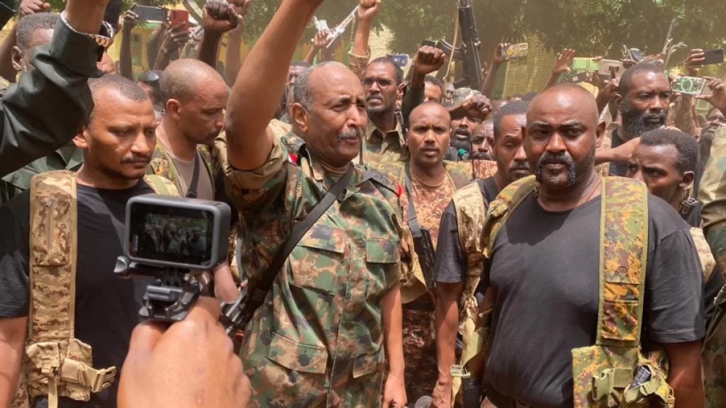 Army chief Abdel Fattah al Burhan cheers on soldiers as he visits some of their positions in Khartoum