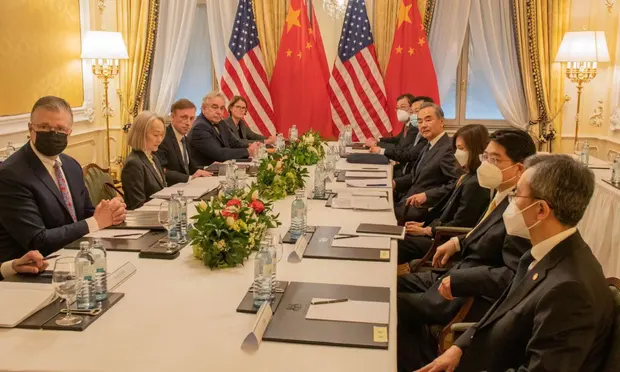 US national security adviser Jake Sullivan and top Chinese diplomat Wang Yi third from top of table on both sides meet with their delegations in Vienna