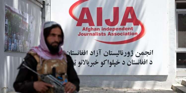 A member of Taliban security force keeps a vigil during an event organised to mark the World Press Freedom Day at the office of the Afghan Independent Journalists Association in Kabul.