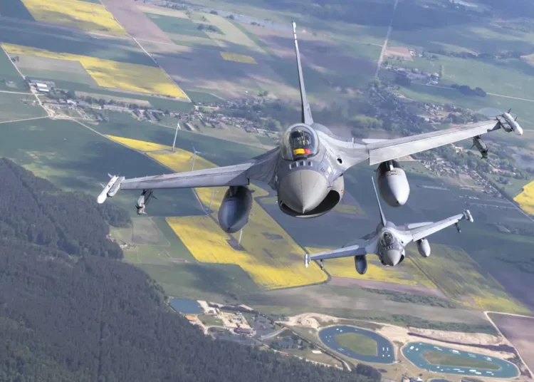 Romanian Air Force F- 16s military fighter jets participating in NATO's Baltic Air Policing Mission operate in Lithuanian airspace, Monday, May 22, 2023.