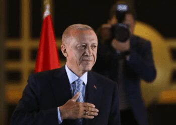 Turkish President and People's Alliance's presidential candidate Recep Tayyip Erdogan gestures to supporters at the presidential palace, in Ankara, Turkey, Sunday, May 28, 2023.