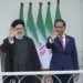Iran's President Ebrahim Raisi, left, and Indonesian President Joko Widodo, right, wave to journalists during their meeting at the Presidential Palace in Bogor, West Java, Indonesia, Tuesday, May 23, 2023.
