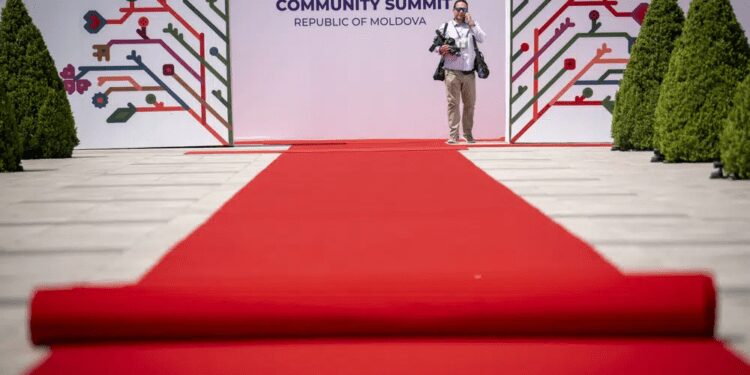 Moldova Poised To Host Second EPC Summit 1 A man stands by banners during preparations at the Castel Mimi in Bulboaca, Moldova, Wednesday, May 31, 2023.