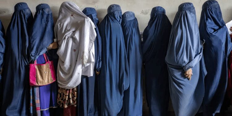 Amnesty International, ICJ Decry Taliban Restrictions On Women And Girls 1 Afghan women wait to receive food rations distributed by a humanitarian aid group, in Kabul, Afghanistan, Tuesday, May 23, 2023.
