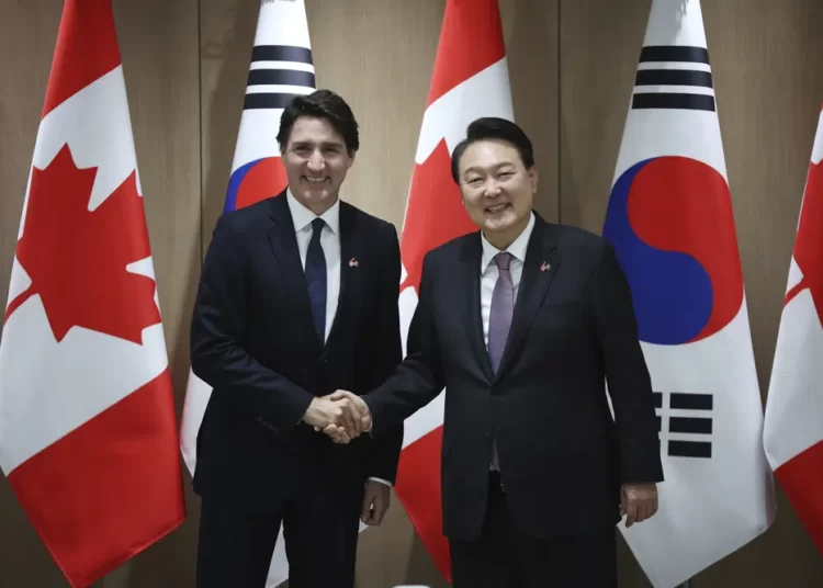 Canada's Prime Minister Justin Trudeau, left, and South Korea's President Yoon Suk Yeol shake hands during their meeting at the Presidential Office in Seoul, South Korea, Wednesday, May 17, 2023.