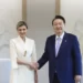 In this photo provided by South Korea Presidential Office, South Korean President Yoon Suk Yeol, right, shakes hands with Ukraine's first lady Olena Zelenska, at the presidential office, in Seoul, South Korea, Tuesday, May 16, 2023.