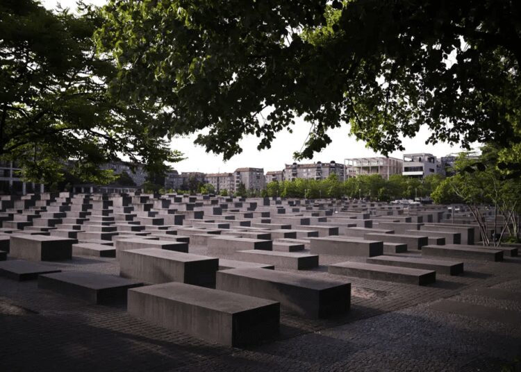 The morning light illuminate the Memorial to the Murdered Jews of Europe, or the Holocaust Memorial in Berlin, Germany, Thursday, June 15, 2023.