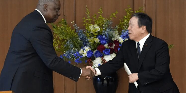 U.S. Defense Secretary Lloyd Austin, left, and Japanese Defense Minister Yasukazu Hamada shake hands at the end of a joint press conference after their meeting at the Defense Ministry in Tokyo Thursday, June 1, 2023.