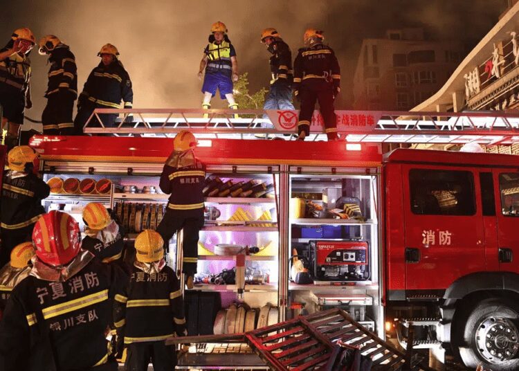Firefighters work at the site of an explosion at a restaurant in Yinchuan, northwest China's Ningxia Hui Autonomous Region Wednesday, June 21, 2023.