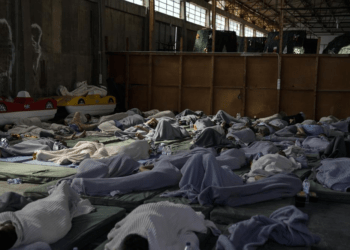Greece Shipwreck: IOM, UNHCR Call For “Urgent And Decisive Action” From EU 3 Survivors of a shipwreck sleep at a warehouse at the port in Kalamata town, about 240 kilometers (150 miles) southwest of Athens, Wednesday, June 14, 2023.