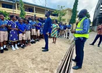 Green Ghana Day 2023: ECG Cautions Individuals From Planting Trees Beneath Low-Voltage Lines 1 ECG officials with students on Green Ghana Day