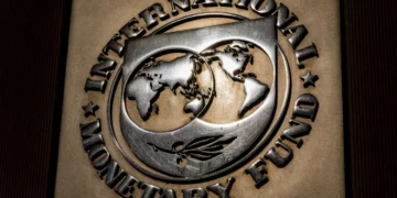 The logo of the International Monetary Fund is visible on its building, April 5, 2021, in Washington.