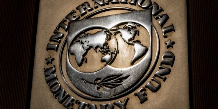 The logo of the International Monetary Fund is visible on its building, April 5, 2021, in Washington.