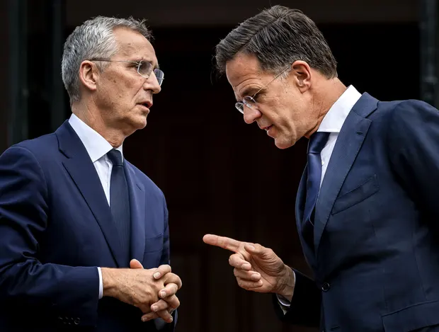 Nato chief Jens Stoltenberg left is greeted by Dutch prime minister Mark Rutte