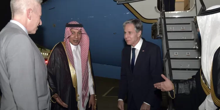 Secretary of State Antony Blinken greets U.S. ambassador to Saudi Arabia Michael Ratney, left, and Saudi officials upon his arrival in Jeddah, Saudi Arabia.