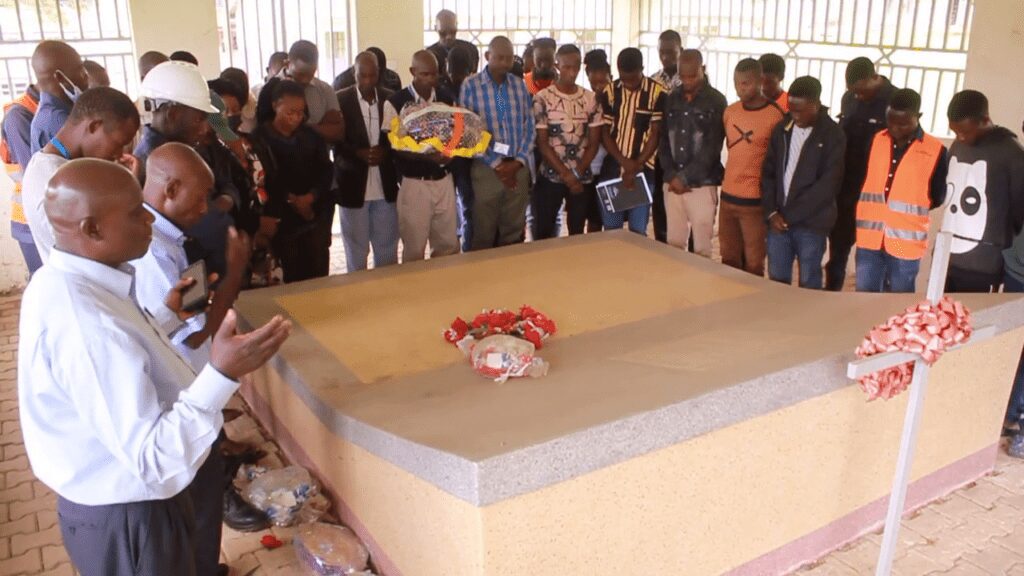 Some survivors and students of Kichwamba Technical College lay a wreath on the mass grave at the college on June 8 in remembrance of students who were killed by the ADF rebels in 1998