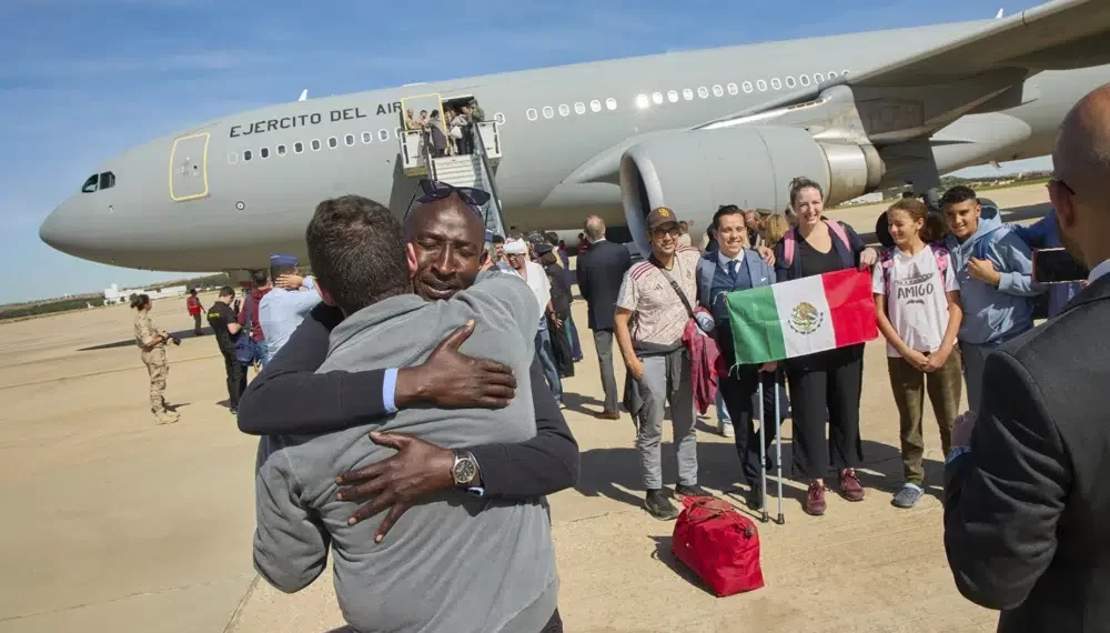 110 Million People Now Displaced, As Sudan And Ukraine Add To The Numbers, UN Says 1 Spanish Defence Ministry passengers from Sudan disembark from a Spanish Air Force aircraft at Torrejon Air Base in Madrid.