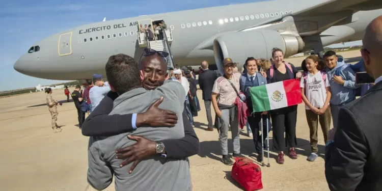 Spanish Defence Ministry passengers from Sudan disembark from a Spanish Air Force aircraft at Torrejon Air Base in Madrid.