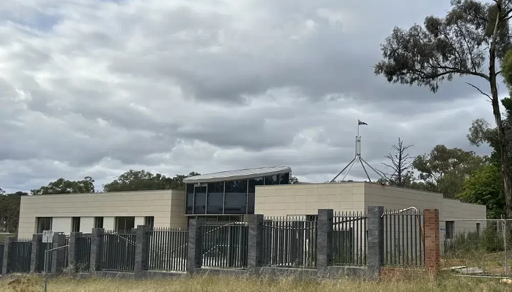 Australia’s Parliament Blocks Russia’s New Embassy Project 1 The Australian flag flies on Parliament House, seen behind an unoccupied building on the grounds of a proposed new Russian embassy near the Australian Parliament in Canberra.