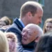 The Prince of Wales hugs an emotional well-wisher, named as William Burns, during a visit to Glasgow to hear about the challenges of homelessness.
