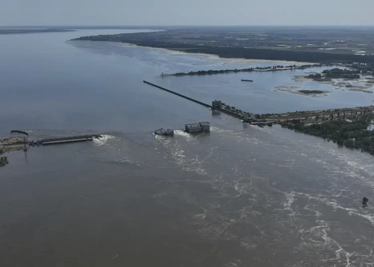 Russia Declines UN’s Aids For Kakhovka Dam Victims 1 Water flows over the collapsed Kakhovka Dam in Nova Kakhovka, in Russian-occupied Ukraine.