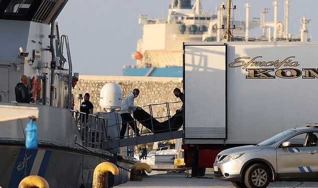 “Floating Coffins”: Meeting Death While Seeking A Future Of Hope 1 Rescue workers carry bodies from a coast guard vessel to a refrigerated truck at the port in Kalamata town.