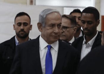 Israeli Prime Minister Benjamin Netanyahu, center, arrives at the District Court in Jerusalem, Israel, Sunday, June 25, 2023.
