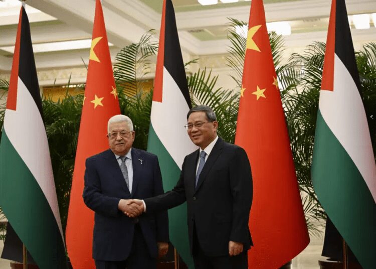 Chinese Premier Li Qiang, right, receives Palestinian President Mahmud Abbas at the Great Hall of the People in Beijing on Thursday, June 15, 2023.
