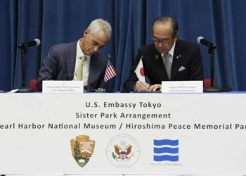 U.S Ambassador to Japan, Rahm Emanuel, left, and Hiroshima Mayor, Kazumi Matsui sign a sister park agreement between the Pearl Habor National Memorial and the Hiroshima Peace Memorial Park , June 29, 2023, in Tokyo.