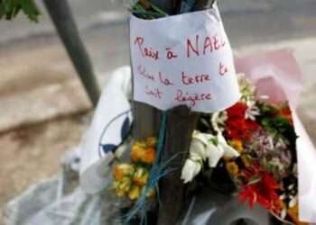 France: Police Office Who Shot Nahel To Be Investigated For Voluntary Homicide 3 Tributes left at the scene where a 17-year-old Nahel M was killed by police.