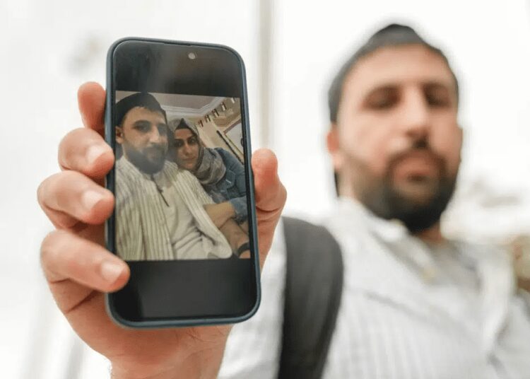 IOM Claims Greece Shipwreck Could Be The Second Deadliest In The Region 1 Kassem Abo Zeed holds up a photograph with his wife, Ezra, who is missing after a fishing boat carrying migrants sank off southern Greece, in the southern port city of Kalamata, Thursday, June 15, 2023.